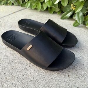 Reef Black Slide Sandals with Gold Logo Accent